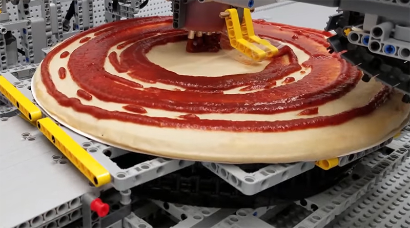 Amazing LEGO creation tops and slices pizza